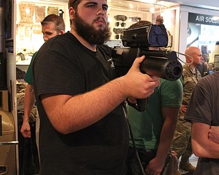Neighbors | Abby Slanker.A Mahoning County Career and Technical Center student checked out the XM25 Counter Defilade Target Engagement System simulator during a visit to the Army Adventure Semi AS1 on May 2.