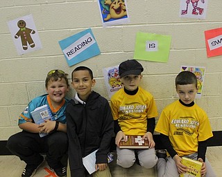 Neighbors | Abby Slanker.A group of Hilltop Elementary School third-grade students sat at the reading station in the gym after playing giant Candyland, while celebrating the school’s annual Right to Read Week with the theme “Reading is Sweet” on May 9.