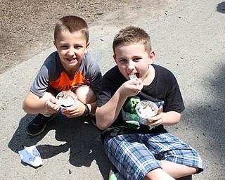 Neighbors | Abby Slanker.Two C.H. Campbell Elementary School first-graders ate their ice cream sundaes before playing on the playground during the school’s annual Student Appreciation Day on May 19.