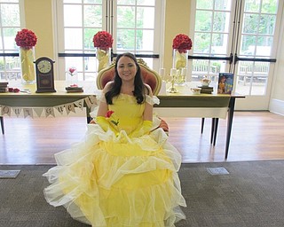 Neighbors | Alexis Bartolomucci.A Public Library of Mahoning County staff member dressed up as Belle from "Beauty and the Beast" for the Poland library program "Be Our Guest."