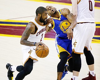 Kevin Love sets a screen for Kyrie Irving in Game 3 of the NBA Finals. Golden State won 118-113. (Photo Credit: Associated Press)