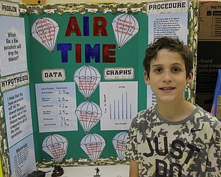 Neighbors | Abby Slanker.A Hilltop Elementary School fourth-grade student conducted a scientific experiment to find out which 8-inch by 6-inch parachute would drop the slowest for the school’s annual Science Fair on May 26.
