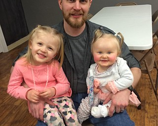 Dad Daniel Takas with daughters Victoria and Elizabeth of Canfield.
