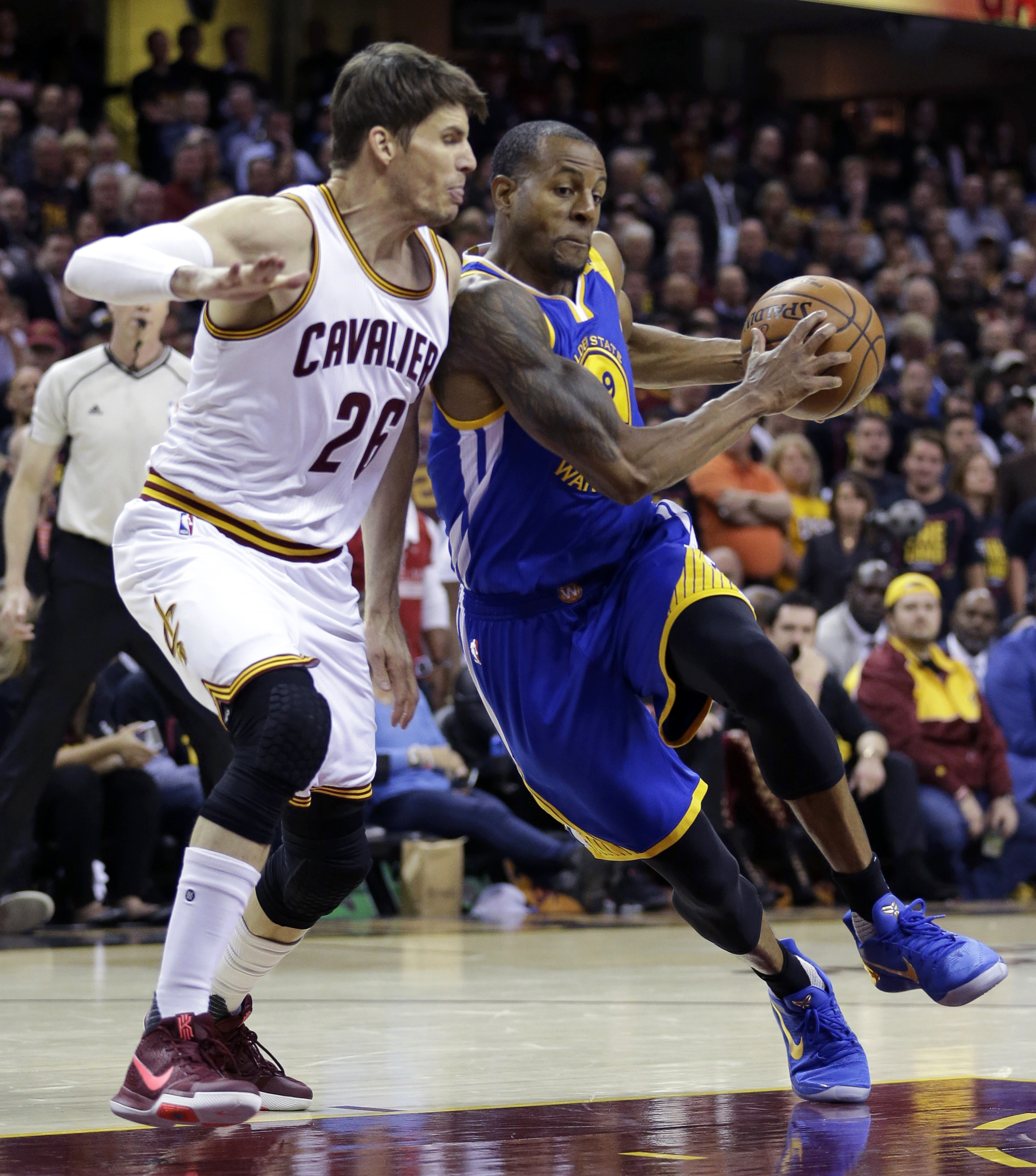 Kyle Korver of the Cleveland Cavaliers defends against Andre Iguodala in Game 3 of the NBA Finals. Golden State won 118-113. (Photo Credit: Associated Press)