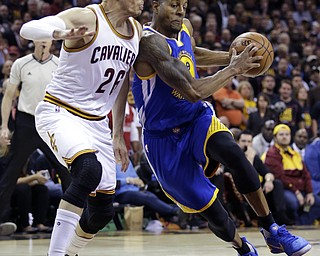 Kyle Korver of the Cleveland Cavaliers defends against Andre Iguodala in Game 3 of the NBA Finals. Golden State won 118-113. (Photo Credit: Associated Press)