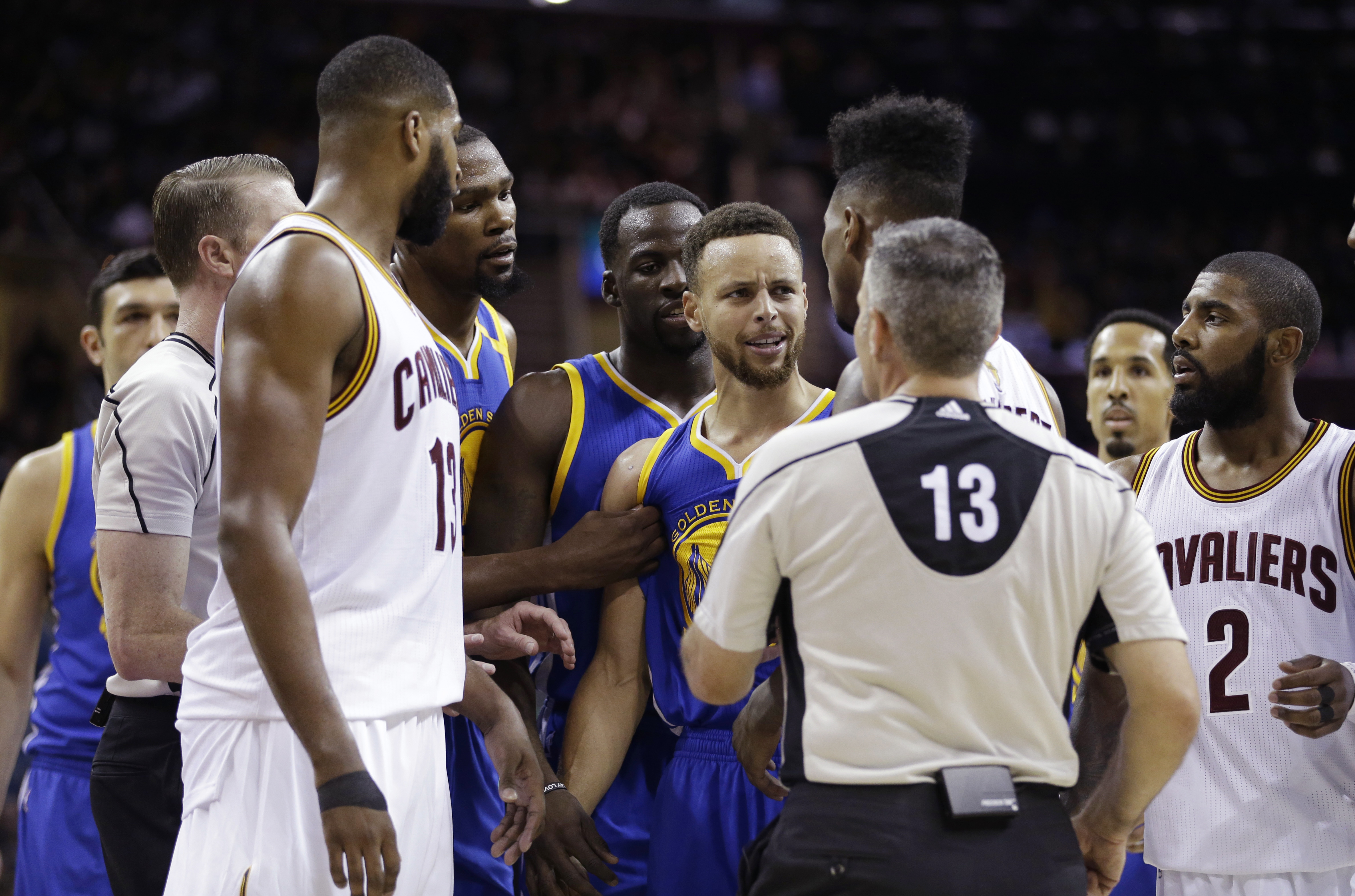 Steph Curry of the Golden State Warriors and Iman Shumpert of the Cleveland Cavaliers exchange words during Game 3 of the NBA Finals. Golden State won 118-113. (Photo Credit: Associated Press)