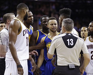 Steph Curry of the Golden State Warriors and Iman Shumpert of the Cleveland Cavaliers exchange words during Game 3 of the NBA Finals. Golden State won 118-113. (Photo Credit: Associated Press)