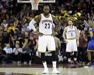 LeBron James of the Cleveland Cavaliers stands at half-court in Game 3 of the NBA Finals. Golden State won 118-113. (Photo Credit: Associated Press)