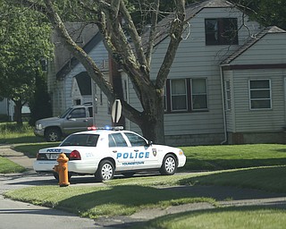 A police cruiser blocks off the corner of Rush Blvd and E Judson Ave as Youngstown Police search a house on the 200 block of E Judson Ave, Thursday, June 1, 2017 in Youngstown...(Nikos Frazier | The Vindicator)