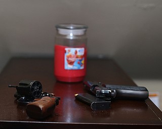 Two of six guns found in the upstairs room as Youngstown Police search a house on the 200 block of E Judson Ave, Thursday, June 1, 2017 in Youngstown...(Nikos Frazier | The Vindicator)