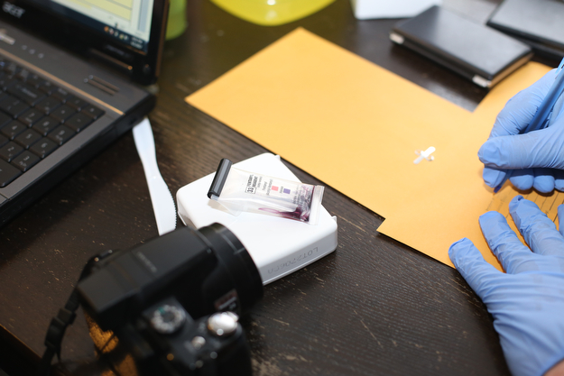 A field test with the positive purple marker signifying Fentanyl presence as Youngstown Police search a house on the 200 block of E Judson Ave, Thursday, June 1, 2017 in Youngstown...(Nikos Frazier | The Vindicator)