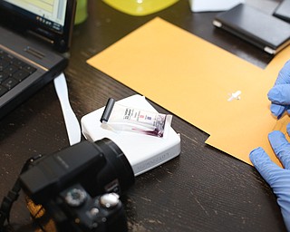 A field test with the positive purple marker signifying Fentanyl presence as Youngstown Police search a house on the 200 block of E Judson Ave, Thursday, June 1, 2017 in Youngstown...(Nikos Frazier | The Vindicator)