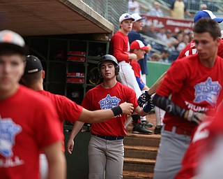 Trumbull County runner Alex Bell(23)(Maplewood) celebrates in the dugout after a run in the 5th inning in the 2017 High School Valley All Star Classic, Friday, June 9, 2017 at Eastwood Field. Trumbull County won 8-6...(Nikos Frazier | The Vindicator)..