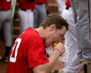 Trumbull County player Brock Sloan(30)(Bristol) enjoys a taco during the 6th inning in the 2017 High School Valley All Star Classic, Friday, June 9, 2017 at Eastwood Field. Coach Don Lee bought the team tacos in celebration after their first of 8 runs. Trumbull County won 8-6. ..(Nikos Frazier | The Vindicator)..