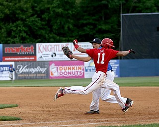 Trumbull County runner Tre Martin(11)(Niles) clears first as Mahoning County first baseman Connor Hendricks(24)(West Branch) waits for the pass during the 6th inning in the 2017 High School Valley All Star Classic, Friday, June 9, 2017 at Eastwood Field. Trumbull County won 8-6...(Nikos Frazier | The Vindicator)..