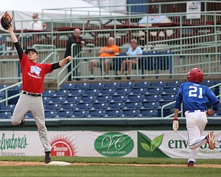 Trumbull County first baseman Hayden Sherwood(16)(Newton Falls) jumps up for the pass off of Trumbull County runner Justin Ciccone(21)(Western Reserve)'s hit during the 8th inning in the 2017 High School Valley All Star Classic, Friday, June 9, 2017 at Eastwood Field. Trumbull County won 8-6...(Nikos Frazier | The Vindicator)..