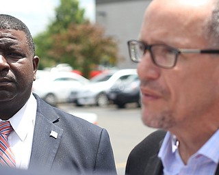 Youngstown Mayor democratic candidate Tito Brown listens as Democratic National Committee (DNC) chairman Tom Perez addresses members of the media at Wedgewood Pizza, Friday, June 9, 2017 in Boardman. Perez visited Ohio two days after President Donald Trump spoke in Cincinnati, which Perez stopped in on Thursday...(Nikos Frazier | The Vindicator)