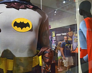 FILE - In this May 29, 2015 file photo, a Batman costume worn by Adam West in the 1960s television show is on display next a Superman costume worn by Christopher Reeve in "Superman IV" at the Louisville Slugger Museum in Louisville, Ky. On Saturday, June 10, 2017, Westâ€™s family said the actor has died at age 88. (AP Photo/Dylan Lovan)