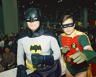 FILE - In this Sunday, Jan. 27, 1989 file photo, actors Adam West, left, and Burt Ward, dressed as their characters Batman and Robin, pose for a photo at the "World of Wheels" custom car show in Chicago. On Saturday, June 10, 2017, Westâ€™s family said the actor, who portrayed Batman in a 1960s TV series, has died at age 88. (AP Photo/Mark Elias, File)