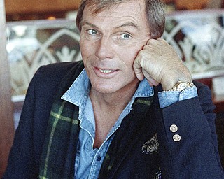 FILE - In this Dec. 11, 1985, file photo, Adam West poses for a photo in Los Angeles. On Saturday, June 10, 2017, his family said the actor, who portrayed Batman in a 1960s TV series, has died at age 88. (AP Photo/Lennox McLendon, File)