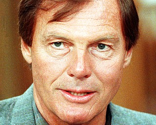 FILE - This Jan. 14, 1989 file photo shows Adam West in New York. On Saturday, June 10, 2017, his family said the actor, who portrayed Batman in a 1960s TV series, has died at age 88. (AP Photo/Richard Drew, File)