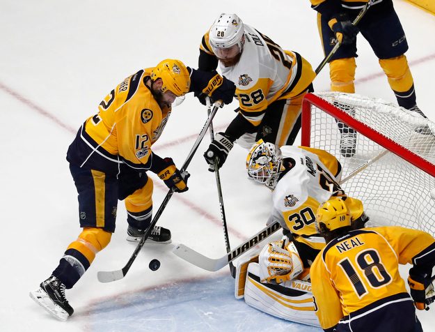 Pittsburgh Penguins' Matt Murray (30) and Ian Cole (28) block a shot by Nashville Predators' Mike Fisher during the third period of Game 6 of the NHL hockey Stanley Cup Final, Sunday, June 11, 2017, in Nashville, Tenn. (AP Photo/Jeff Roberson)