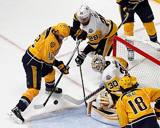 Pittsburgh Penguins' Matt Murray (30) and Ian Cole (28) block a shot by Nashville Predators' Mike Fisher during the third period of Game 6 of the NHL hockey Stanley Cup Final, Sunday, June 11, 2017, in Nashville, Tenn. (AP Photo/Jeff Roberson)