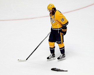 Nashville Predators' James Neal (18) skates by a catfish thrown onto the ice during the third period of Game 6 of the NHL hockey Stanley Cup Final against the Pittsburgh Penguins, Sunday, June 11, 2017, in Nashville, Tenn. (AP Photo/Jeff Roberson)