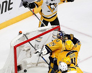 Pittsburgh Penguins' Patric Hornqvist (72), of Sweden, celebrates after scoring a goal against Nashville Predators goalie Pekka Rinne (35), of Finland, during the third period of Game 6 of the NHL hockey Stanley Cup Final, Sunday, June 11, 2017, in Nashville, Tenn. (AP Photo/Jeff Roberson)