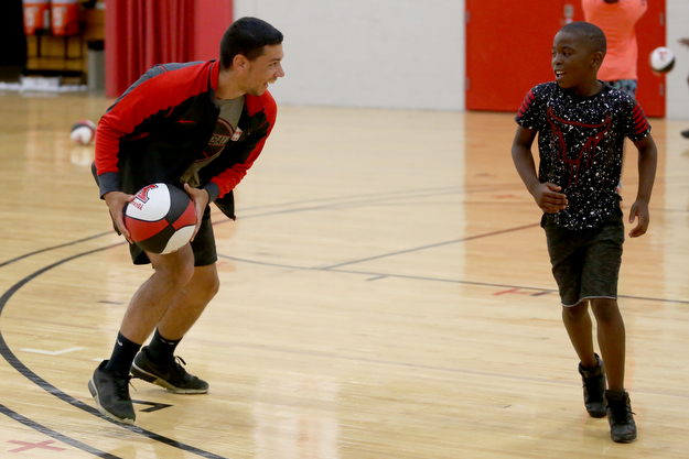 Marcell Underwood(right), 8, and Jared Hayden play 1-on-1 during a basketball camp at the Stambaugh Stadium Basketball courts, Wednesday, June 14, 2017 in Youngstown...(Nikos Frazier | The Vindicator)