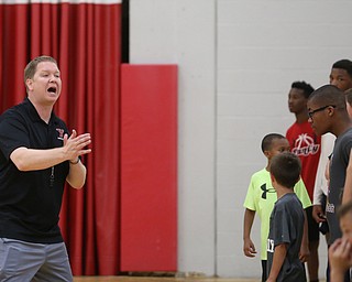Jerrod Calhoun, YSU mens basketball coach, instructs the players during a basketball camp at the Stambaugh Stadium Basketball courts, Wednesday, June 14, 2017 in Youngstown...(Nikos Frazier | The Vindicator)