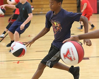 Markwuan Brown(14) of Warren runs a drill during a basketball camp at the Stambaugh Stadium Basketball courts, Wednesday, June 14, 2017 in Youngstown...(Nikos Frazier | The Vindicator)
