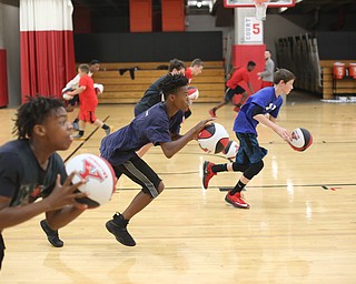 Markwuan Brown(14)(center) of Warren runs a drill during a basketball camp at the Stambaugh Stadium Basketball courts, Wednesday, June 14, 2017 in Youngstown...(Nikos Frazier | The Vindicator)