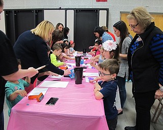 Neighbors | Alexis Bartolomucci.Poland North Preschool students worked with their mothers and grandmothers making a craft after their singing performance.