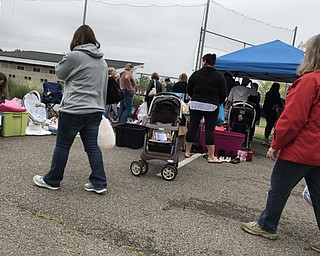 Neighbors | Alexis Bartolomucci.Guests walked around at the Baby Bargain Boutique on May 20 looking for items to purchase from other mothers.