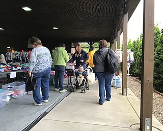 Neighbors | Alexis Bartolomucci.Hundreds of vendors set up tables and tents for the Baby Bargain Boutique on May 20 for guests to browse.