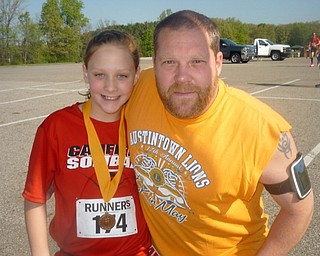Neighbors | Submitted.The Kid's Run kicked off the Austintown Lions 5-K run this year. This year's Kid's Run winner was Alexis Johnson of Canfield (left). She is pictured with her father, Chris.
