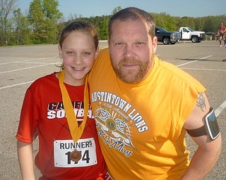 Neighbors | Submitted.The Kid's Run kicked off the Austintown Lions 5-K run this year. This year's Kid's Run winner was Alexis Johnson of Canfield (left). She is pictured with her father, Chris.