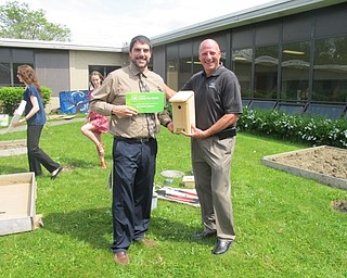 Neighbors | Alexis Bartolomucci.Scott Lenhart, Boardman Glenwood science teacher, stood with Boardman Subaru owner, Rob Fellman, at the Glenwood Junior High courtyard garden where the students will plant flowers and hang up food and homes for wildlife.