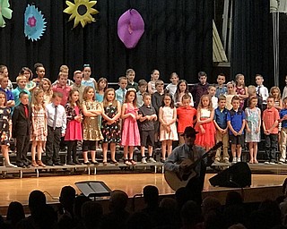 Neighbors | Alexis Bartolomucci.Music instructor, Dean Wilson, played guitar during one of the performances from the Poland Union students.