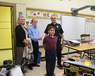 Neighbors | Alexis Bartolomucci.Drew Caputo won the runner-up position at St. Charles for the bike safety poster contest and received a helment and a gift card from Boardman Optimist Club members Nancy Hildebrand, Chester Horlick and Sgt. Charles Hillman.