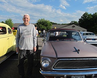 Neighbors | Alexis Bartolomucci.One of the founders of the Mahoning Valley Olde Car Club, Bud Gane, stood next to one of the cars on show at the Austintown Senior Center Tuesday Cruise Nite on May 31.