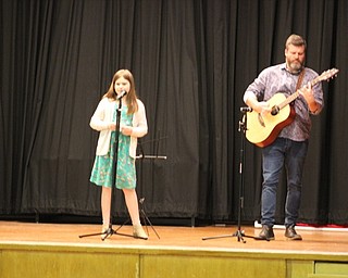 Neighbors | Abby Slanker.A C.H. Campbell Elementary School fourth-grade student was accompanied by her father on the guitar as she sang “Wheel of Fortune” at the school’s Talent Show on May 26.