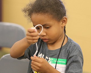 ROBERT K. YOSAY | THE VINDICATOR..Rosario Exodus 6 ties her rubber band launcher -..Camp Invention for kids in K-6 - It aims to empower the next generation of innovators by exploring the results of turning ideas into inventions and bringing those inventions to market..