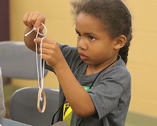        ROBERT K. YOSAY  | THE VINDICATOR.. Exodus Rosario, 6  ties his rubber band launcher -..Camp Invention is for kids in K-6 - It aims to empower the next generation of innovators by exploring the results of turning ideas into inventions and bringing those inventions to market..