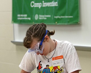        ROBERT K. YOSAY  | THE VINDICATOR..Under the camp invention sign  -katelynn sayers 6th grade. takes apart a computer keyboard..Camp Invention for kids in K-6 - It aims to empower the next generation of innovators by exploring the results of turning ideas into inventions and bringing those inventions to market..
