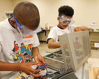        ROBERT K. YOSAY  | THE VINDICATOR..Getting into the guts of the machine as they take apart a computer is Zyquese (ok) Brown and Keenan Logan both 10..Camp Invention for kids in K-6 - It aims to empower the next generation of innovators by exploring the results of turning ideas into inventions and bringing those inventions to market..