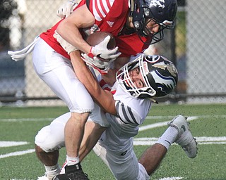 Mahoning's JC Mikoich (22) of fitch is stopped by Trumbull'sNicholas Hall(10) of Girard during Arvin Classic at Hubbard.