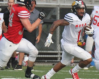 William D. Lewis The Vindicator  Trumbull's Lynn Bowden(1) of Haring eludes Mahoning's Bryce Warmouth(34) of Fitch.