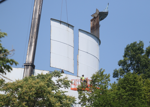        ROBERT K. YOSAY  | THE VINDICATOR..The southside landmark Water Tower on Indianola is slowly being dismantled by All Industrial Services Inc. of Boardman.  The tower.. Built in 1932 has been out of service for several years and actually  was built on a water tank that dated back to 1912..